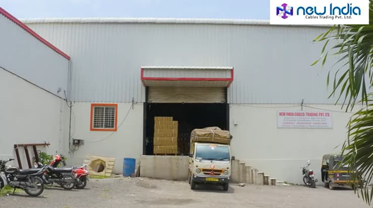 New India Cables Delivery Truck Outside Warehouse in Pune